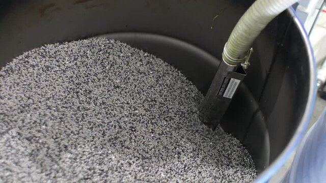 Barrel with polypropylene granules in the technological process. PP Pet Chips Semi Dull, PET chips recycle, PET polyester chips
