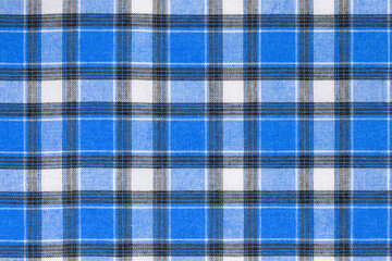 Blue white tartan texture background. shirt fabric with a checkered pattern. factory material