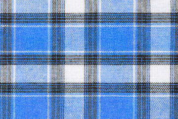 Blue white tartan texture background. shirt fabric with a checkered pattern. factory material