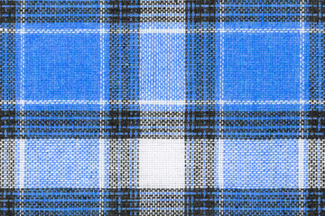 Blue white tartan texture background. shirt fabric with a checkered pattern. factory material