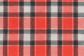 Red white tartan texture background. shirt fabric with a checkered pattern. factory material