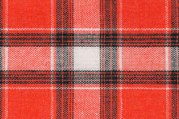 Red white tartan texture background. shirt fabric with a checkered pattern. factory material