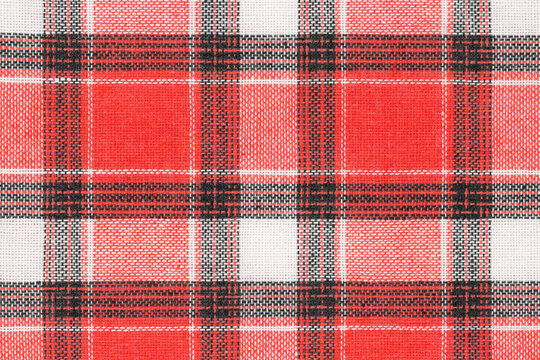 Red White Tartan Texture Background. Shirt Fabric With A Checkered Pattern. Factory Material