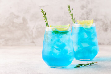 Refreshing blue drink or cocktail with ice