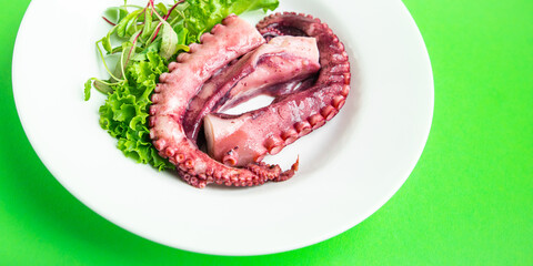 octopus food in a plate seafood second course fresh ready to eat meal snack on the table copy space food background rustic. top view keto or paleo vegetarian food no meat pescetarian diet © Alesia Berlezova