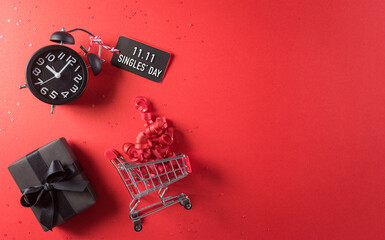 Online shopping of China, 11.11 singles day sale concept. Top view of shopping cart, black...