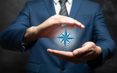 man holding a compass icon in his hand