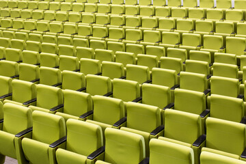 rows of green seats in a theatre