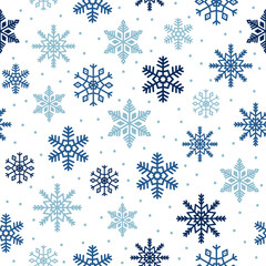 Snowflakes seamless pattern. Blue snowflakes and dots on white background. Background for winter design. 