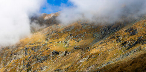 panoramic landscape with clouds on the ridges of the Fagaras mountains