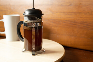 Making coffee with French press method
