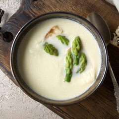 bowl of asparagus cream soup on the table