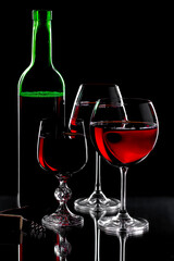 Glasses of wine on a black background.