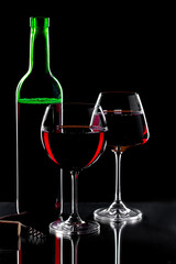 Glasses of wine on a black background.