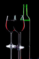 Red wine in a glass, on a black background.