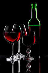 Glasses of wine on a black background.