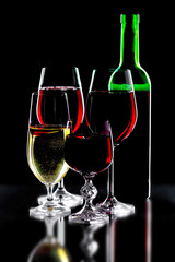 Glasses of wine on a black background.