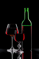 Glasses of wine on a black background.