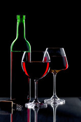 Glasses of wine on a black background.