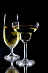 Glasses of wine on a black background.