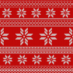 Obraz premium Knitted red Christmas background, ornament with snowflakes. Seamless pattern. Texture for fabric, wrapping, wallpaper. Decorative print.