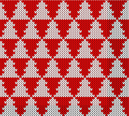 Knitted Christmas background, ornament with christmas trees. Seamless pattern. Texture for fabric, wrapping, wallpaper. Decorative print.