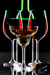 Red wine in a glass, on a black background.