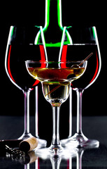Glasses of wine on a black background.