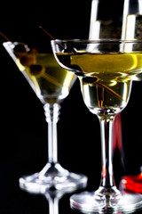 Glasses of wine on a black background.