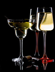 Glasses of wine on a black background.