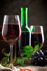 Fototapeta premium Wine in a glass on an old background