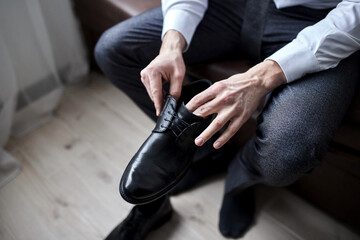 Fototapeta premium businessman clothes shoes, man getting ready for work,groom morning before wedding ceremony. Men Fashion