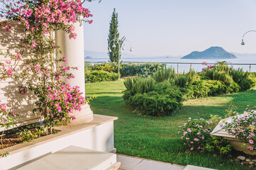 Sea view at mediterrianean sea and an island in the summer garden of turkish hotel