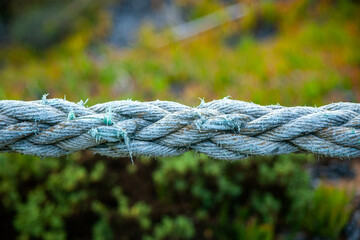 Old rope to be used as a handrail on the stairs to a beach