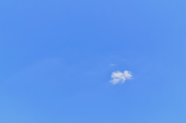 Small, fluffy and lonely clouds in the skies of blue