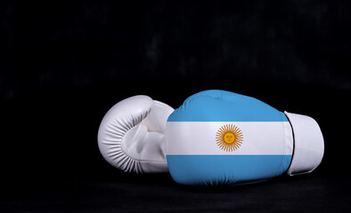 Boxing glove with Argentina flag on black background