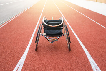 Athletic stadium track and a race wheelchair on it.