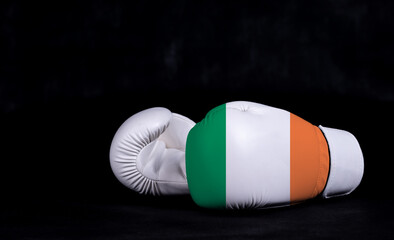 Boxing glove with Ireland flag on black background