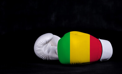 Boxing glove with Mali flag on black background
