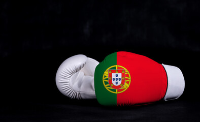Boxing glove with Portugal flag on black background