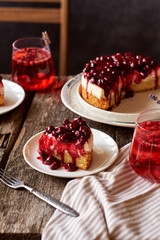 Cherry cake. Breton shortcrust pastry. Cheesecake. Cherry sauce. Side view. Wooden background. Piece of cake