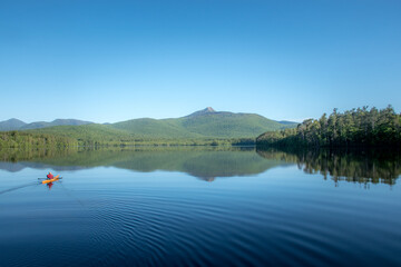 Kayaker on Chocorua Lake in front of Mount Chocorua.