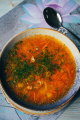 a traditional dish of Russian and Ukrainian cuisine, red borscht, with herbs and garlic