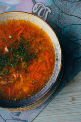 a traditional dish of Russian and Ukrainian cuisine, red borscht, with herbs and garlic