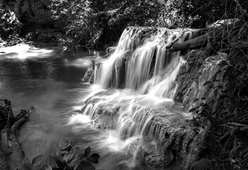 Waterfall in nature. Mountain cascade river waterfall. Black and white