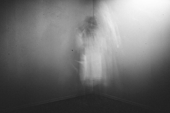 Ghostly figure watching from the corner of the room