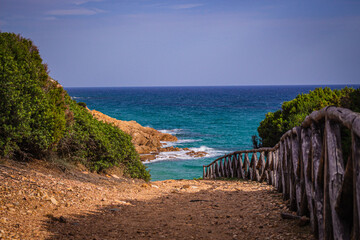 Path to the sea with a wooden fence