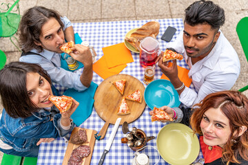group of friends having fun at garden home party - Young people smiling together drinking beer