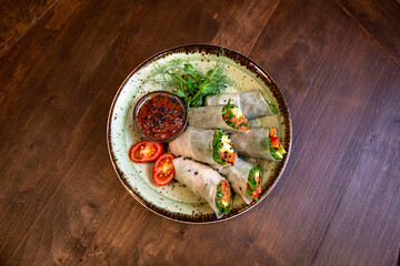 Healthy vegetable salad of fresh tomato, cucumber, onion, spinach, lettuce and sesame on plate. Diet menu.