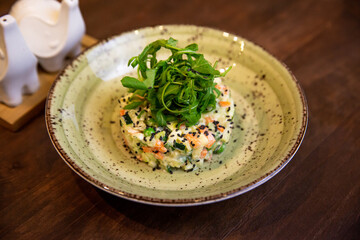 Healthy vegetable salad of fresh tomato, cucumber, onion, spinach, lettuce and sesame on plate. Diet menu.